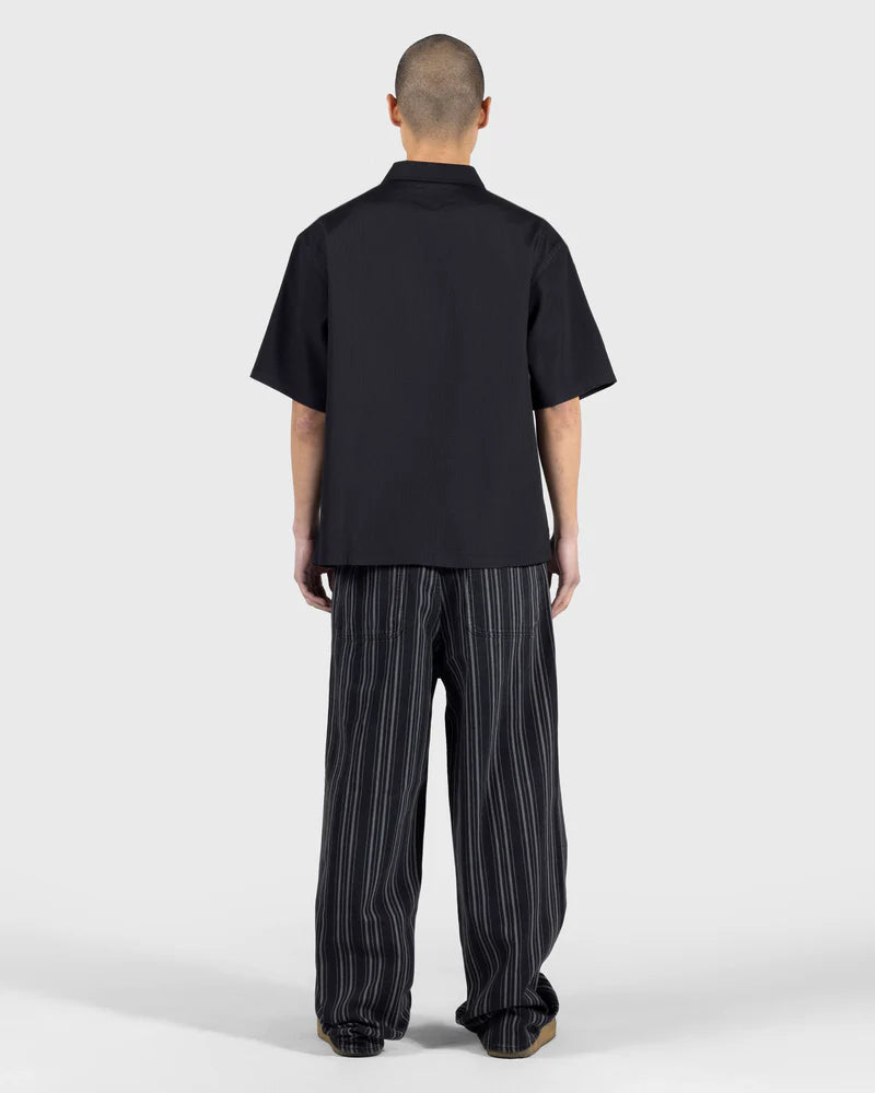 PLEASURES Electron Zip Polo