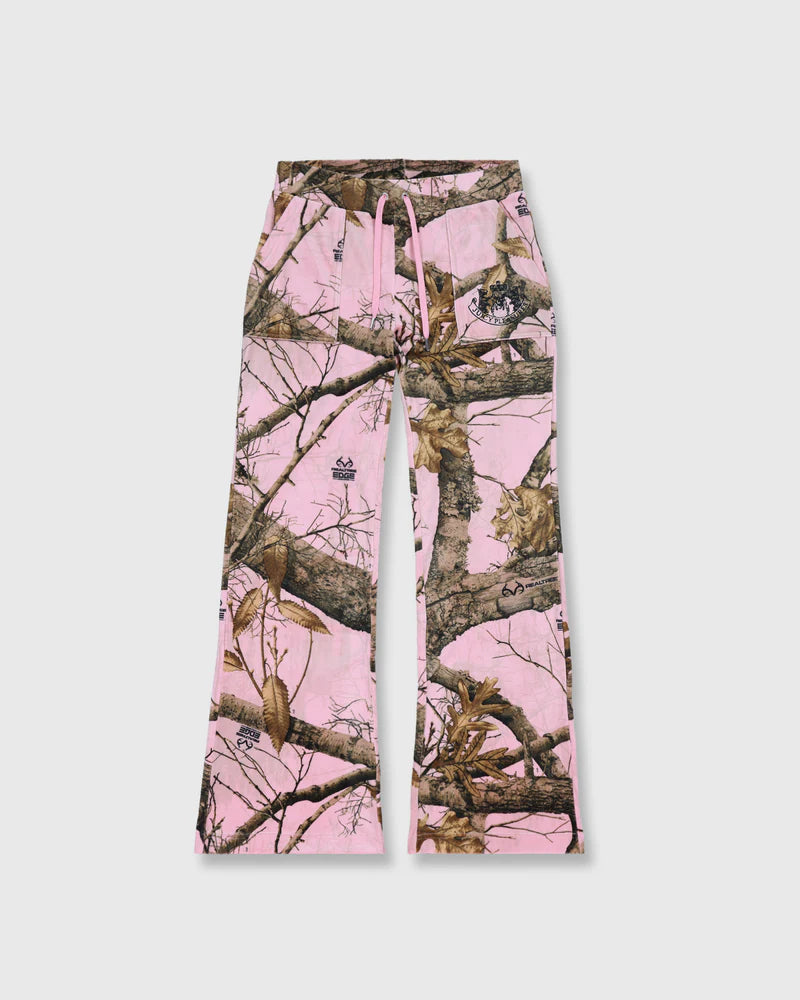 Pink camouflage pants with tree branch pattern on a white background