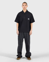 PLEASURES Electron Zip Polo