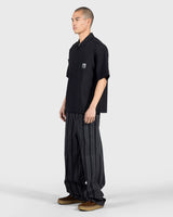 PLEASURES Electron Zip Polo