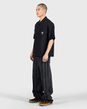 PLEASURES Electron Zip Polo