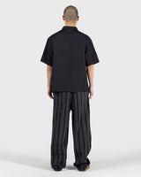 PLEASURES Electron Zip Polo